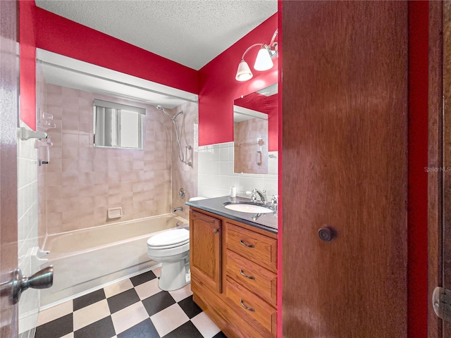 10520 SW 85th Ter, Ocala, FL 34481 - full bathroom featuring tile patterned floors, toilet, bathtub / shower combination, vanity, and tile walls