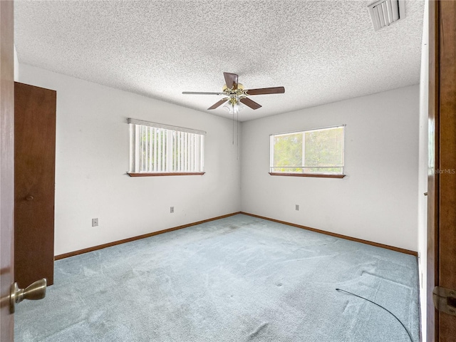 10520 SW 85th Ter, Ocala, FL 34481 - carpeted empty room with a ceiling fan, a textured ceiling, and baseboards