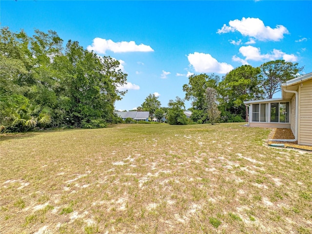 10520 SW 85th Ter, Ocala, FL 34481 - view of green lawn featuring a sunroom