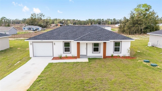 15424 SW 27th Ln, Ocala, FL 34481 - view of front of home featuring roof with shingles, a front yard, driveway, and stucco siding