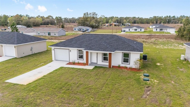 15424 SW 27th Ln, Ocala, FL 34481 - view of front of home featuring concrete driveway, a front lawn, a shingled roof, stucco siding, and central AC