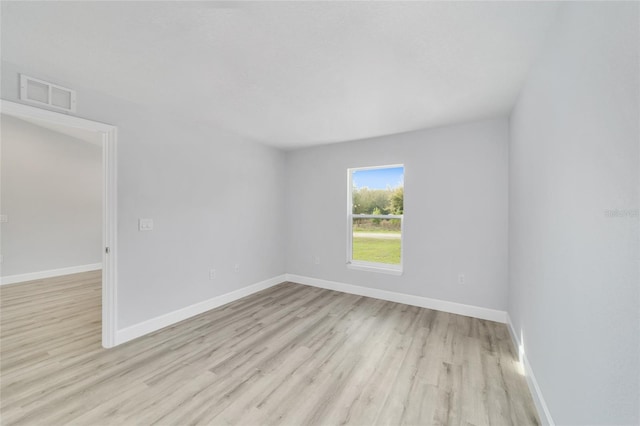 15424 SW 27th Ln, Ocala, FL 34481 - spare room with light wood-style flooring and baseboards