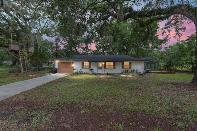 3800 NE 24th Ct, Ocala, FL 34479 - single story home with driveway, an attached garage, a storage shed, and a front lawn
