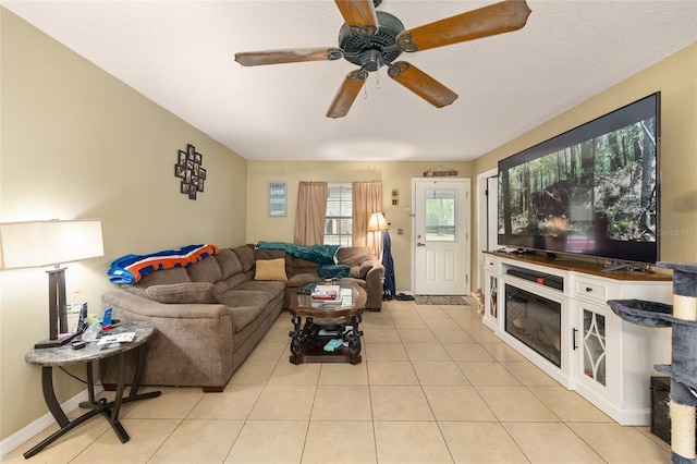 3800 NE 24th Ct, Ocala, FL 34479 - living room featuring light tile patterned floors, ceiling fan, and baseboards
