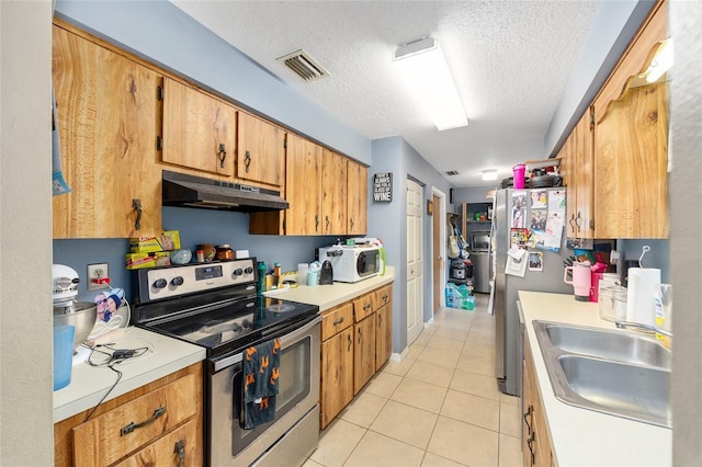 3800 NE 24th Ct, Ocala, FL 34479 - kitchen with electric stove, under cabinet range hood, a sink, light countertops, and light tile patterned flooring