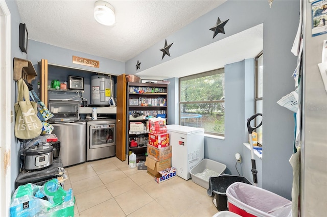 3800 NE 24th Ct, Ocala, FL 34479 - laundry area with separate washer and dryer, water heater, tile patterned flooring, and a textured ceiling