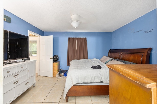 3800 NE 24th Ct, Ocala, FL 34479 - bedroom featuring light tile patterned floors and a textured ceiling