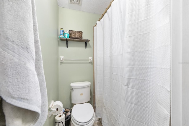 3800 NE 24th Ct, Ocala, FL 34479 - bathroom with toilet and curtained shower