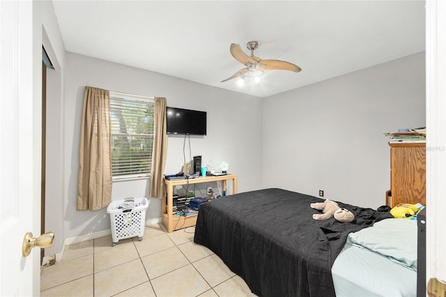 3800 NE 24th Ct, Ocala, FL 34479 - bedroom with light tile patterned flooring, baseboards, a ceiling fan, and a closet