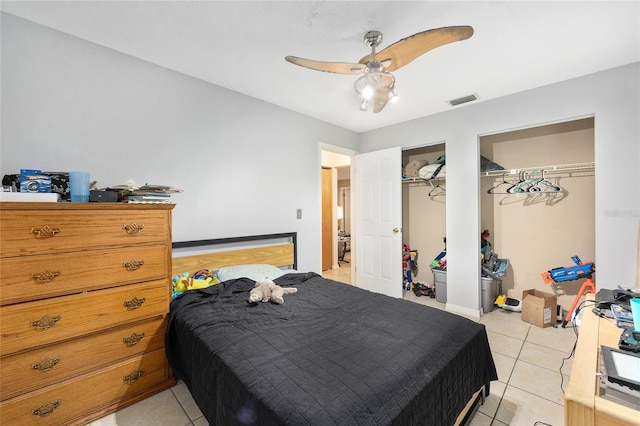 3800 NE 24th Ct, Ocala, FL 34479 - bedroom with multiple closets, light tile patterned flooring, and ceiling fan