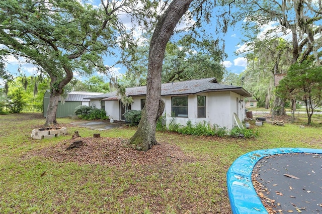 3800 NE 24th Ct, Ocala, FL 34479 - view of front of property featuring stucco siding and a front yard