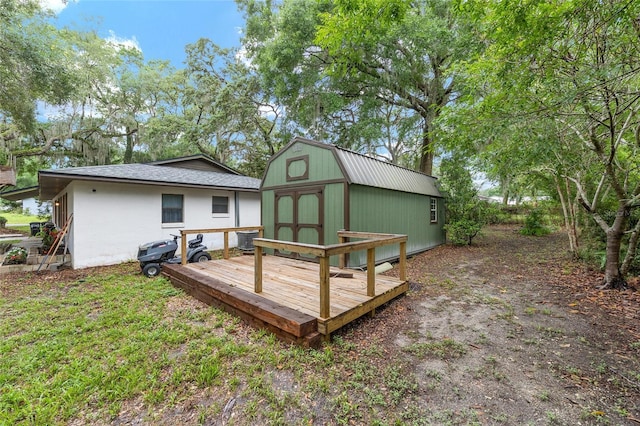 3800 NE 24th Ct, Ocala, FL 34479 - back of house featuring a gambrel roof and a deck