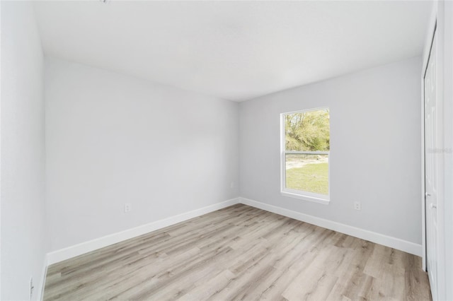 13568 SW 109th Ln, Dunnellon, FL 34432 - spare room featuring light wood-style flooring and baseboards