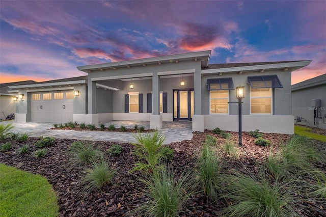 8465 SW 101st Ave, Ocala, FL 34481 - contemporary home featuring stucco siding and an attached garage