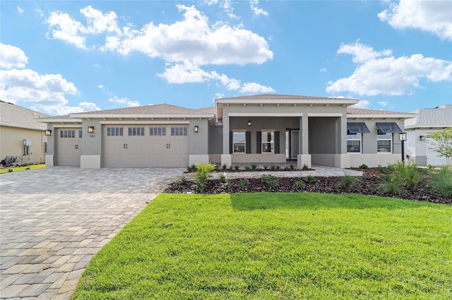 8465 SW 101st Ave, Ocala, FL 34481 - view of front facade featuring stucco siding, a front yard, decorative driveway, and a garage
