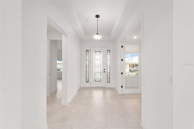 8465 SW 101st Ave, Ocala, FL 34481 - entrance foyer with light tile patterned flooring, baseboards, and a raised ceiling