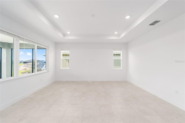 8465 SW 101st Ave, Ocala, FL 34481 - spare room featuring healthy amount of natural light, a raised ceiling, recessed lighting, light tile patterned floors, and baseboards