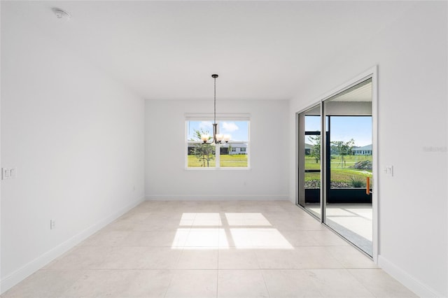 8465 SW 101st Ave, Ocala, FL 34481 - spare room with a chandelier, healthy amount of natural light, light tile patterned flooring, and baseboards