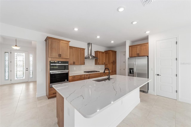 8465 SW 101st Ave, Ocala, FL 34481 - kitchen with appliances with stainless steel finishes, a sink, wall chimney exhaust hood, brown cabinets, and tasteful backsplash