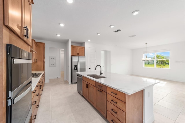8465 SW 101st Ave, Ocala, FL 34481 - kitchen featuring a sink, appliances with stainless steel finishes, brown cabinetry, a chandelier, and recessed lighting