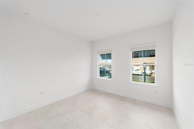 8465 SW 101st Ave, Ocala, FL 34481 - empty room featuring baseboards and a smoke detector