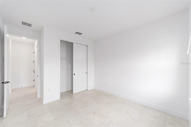 8465 SW 101st Ave, Ocala, FL 34481 - unfurnished bedroom featuring a closet and baseboards