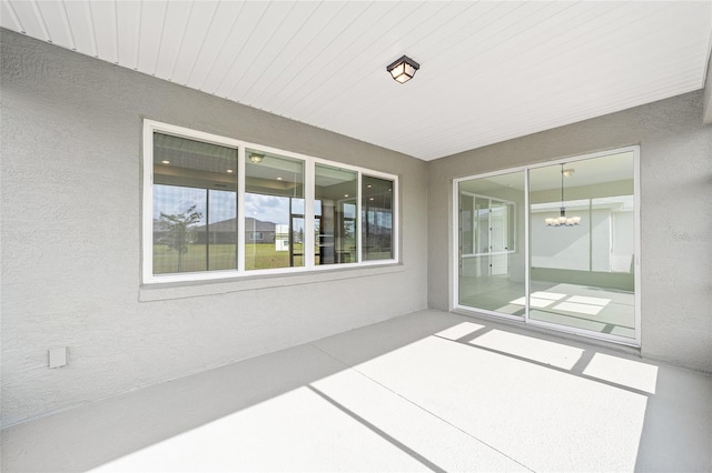 8465 SW 101st Ave, Ocala, FL 34481 - unfurnished sunroom featuring a chandelier