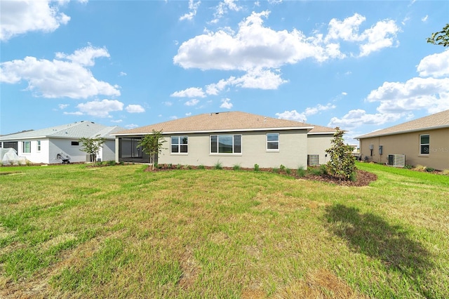8465 SW 101st Ave, Ocala, FL 34481 - back of property featuring central air condition unit and a lawn