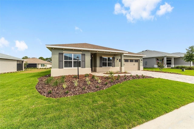 10625 SW 98th Pl, Ocala, FL 34481 - view of front of property with decorative driveway, an attached garage, stucco siding, and a front lawn
