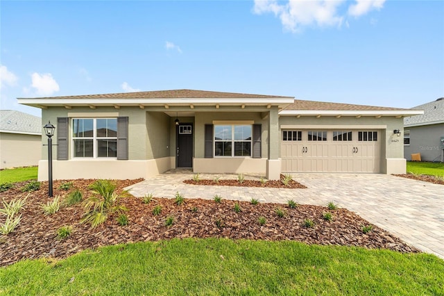 10625 SW 98th Pl, Ocala, FL 34481 - ranch-style home with a garage, stucco siding, and decorative driveway