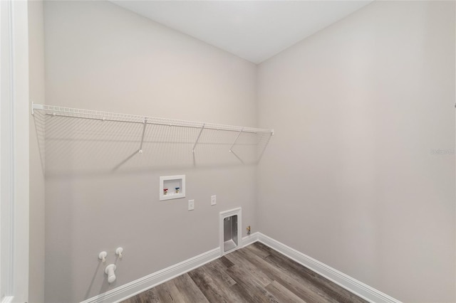 10625 SW 98th Pl, Ocala, FL 34481 - washroom with gas dryer hookup, baseboards, dark wood finished floors, hookup for a washing machine, and hookup for an electric dryer