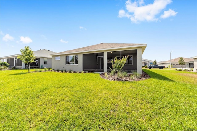 10625 SW 98th Pl, Ocala, FL 34481 - back of house with a sunroom, a yard, and stucco siding