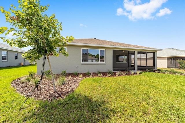 10625 SW 98th Pl, Ocala, FL 34481 - back of house with a sunroom, a lawn, and stucco siding