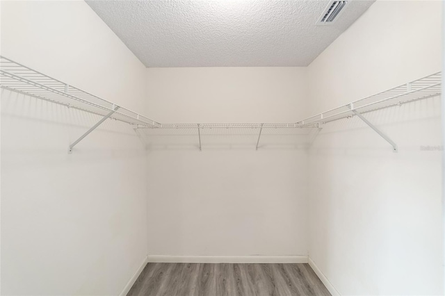 8998 SW 94th St Unit D, Ocala, FL 34481 - walk in closet with light wood finished floors
