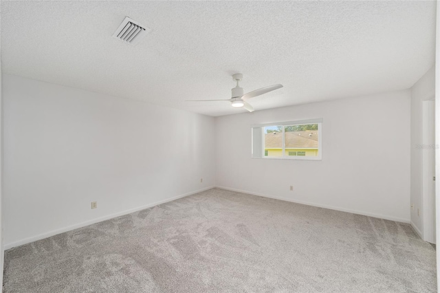 8998 SW 94th St Unit D, Ocala, FL 34481 - spare room with carpet floors, ceiling fan, a textured ceiling, and baseboards