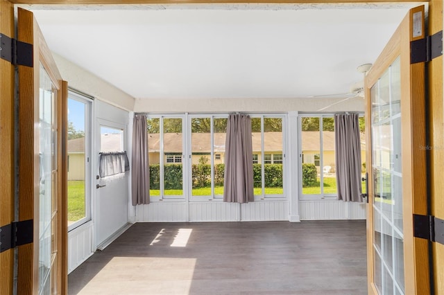 8998 SW 94th St Unit D, Ocala, FL 34481 - unfurnished sunroom featuring wood finished floors