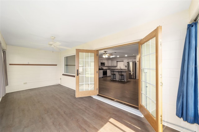 8998 SW 94th St Unit D, Ocala, FL 34481 - spare room with a ceiling fan, dark wood-style floors, french doors, and a sink