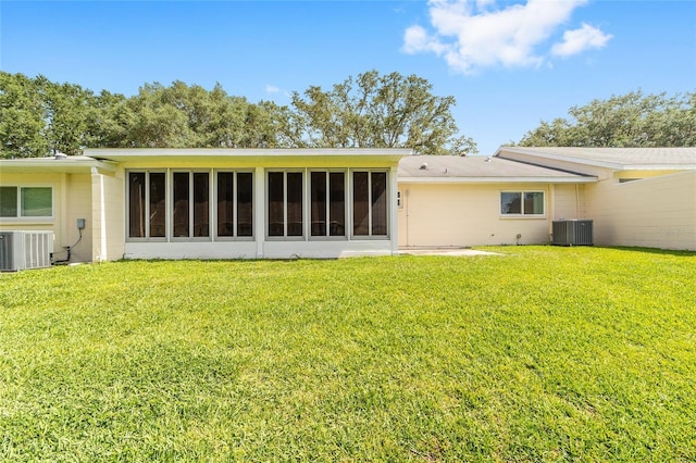 8998 SW 94th St Unit D, Ocala, FL 34481 - rear view of property with a yard, central AC, and a sunroom