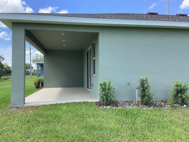 10540 SW 49th Avenue Rd, Ocala, FL 34476 - exterior space featuring stucco siding, a lawn, and a patio area