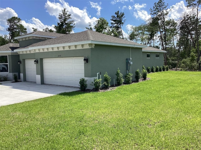 10540 SW 49th Avenue Rd, Ocala, FL 34476 - view of side of home featuring stucco siding, an attached garage, a yard, a shingled roof, and concrete driveway