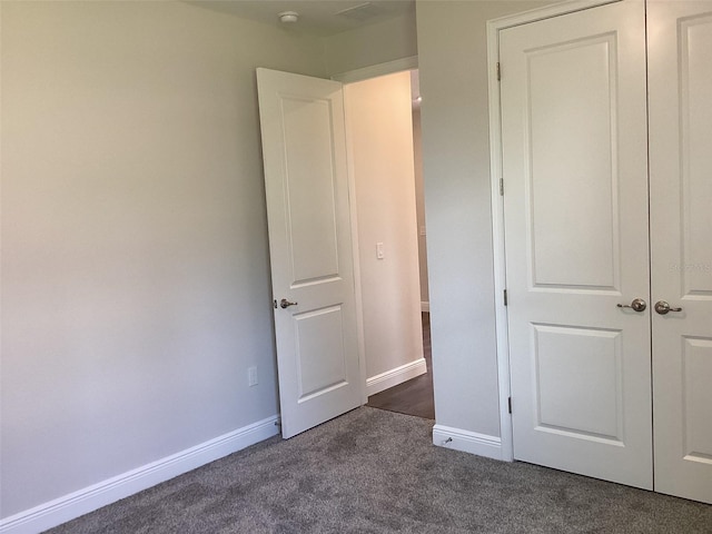 10540 SW 49th Avenue Rd, Ocala, FL 34476 - unfurnished bedroom featuring dark carpet and baseboards