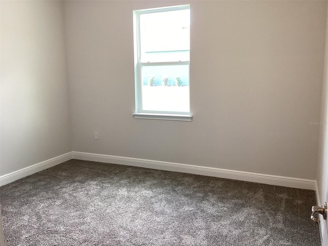 10540 SW 49th Avenue Rd, Ocala, FL 34476 - empty room featuring dark colored carpet and baseboards