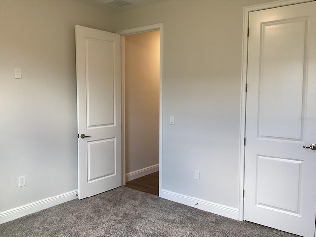 10540 SW 49th Avenue Rd, Ocala, FL 34476 - unfurnished bedroom with dark carpet and baseboards
