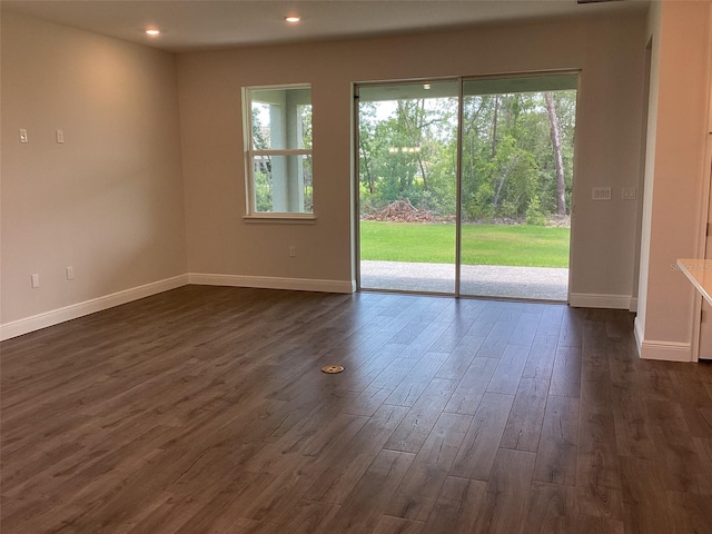 10540 SW 49th Avenue Rd, Ocala, FL 34476 - unfurnished room with baseboards, dark wood-style flooring, and recessed lighting