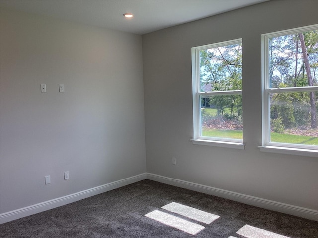 10540 SW 49th Avenue Rd, Ocala, FL 34476 - unfurnished room with dark carpet, plenty of natural light, baseboards, and recessed lighting