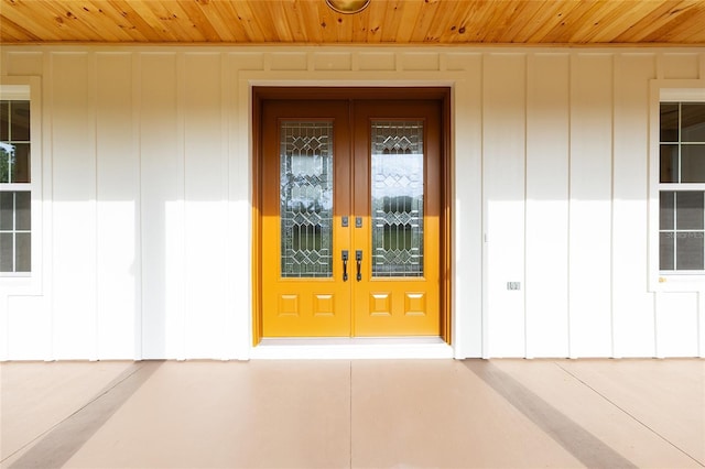 8200 SW 125th Court Rd, Dunnellon, FL 34432 - property entrance featuring french doors and board and batten siding