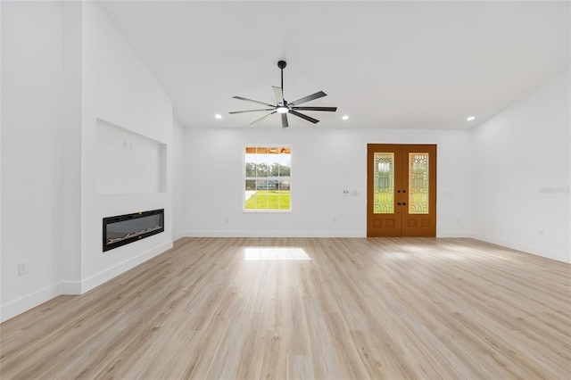 8200 SW 125th Court Rd, Dunnellon, FL 34432 - unfurnished living room featuring a glass covered fireplace, ceiling fan, recessed lighting, light wood-style floors, and baseboards