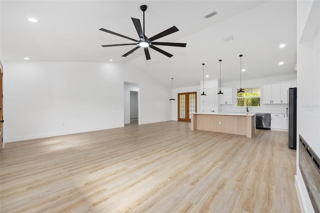 8200 SW 125th Court Rd, Dunnellon, FL 34432 - unfurnished living room featuring lofted ceiling, ceiling fan, a sink, light wood-type flooring, and recessed lighting