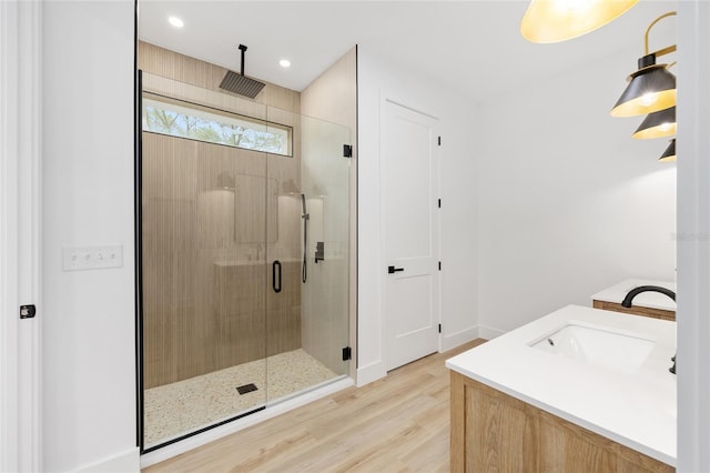 8200 SW 125th Court Rd, Dunnellon, FL 34432 - full bathroom with a shower stall, wood finished floors, vanity, baseboards, and recessed lighting