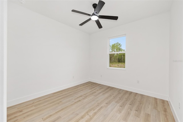 8200 SW 125th Court Rd, Dunnellon, FL 34432 - spare room with wood finished floors, baseboards, and a ceiling fan